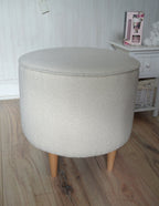 Circular round footstool upholstered in Ivory Boucle Fabric With Natural Hardwood  Legs