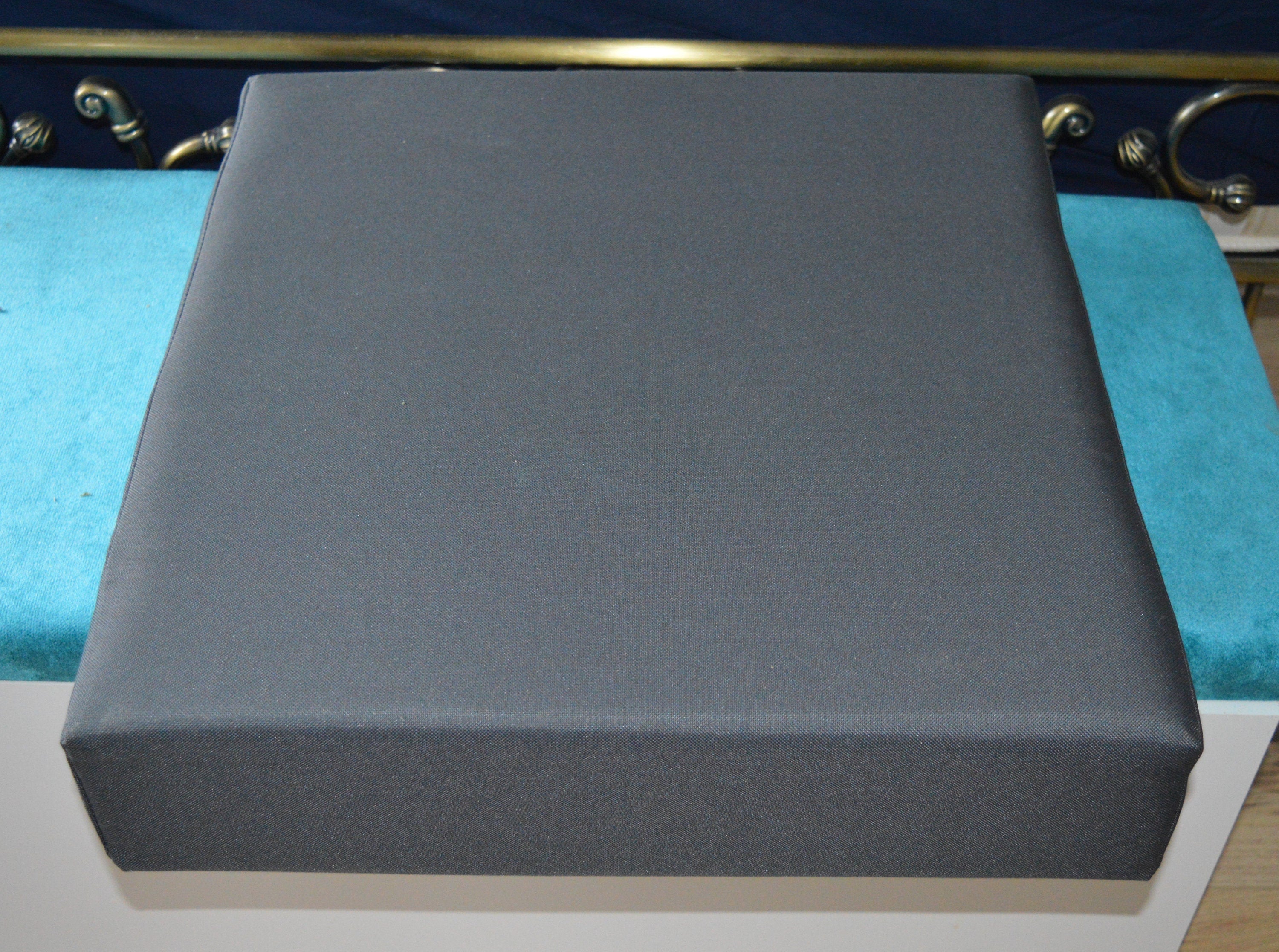 Booster Seat Cushion Upholstered In A Dark Grey  Water Resistant Fabric With A  Firm Foam Filling