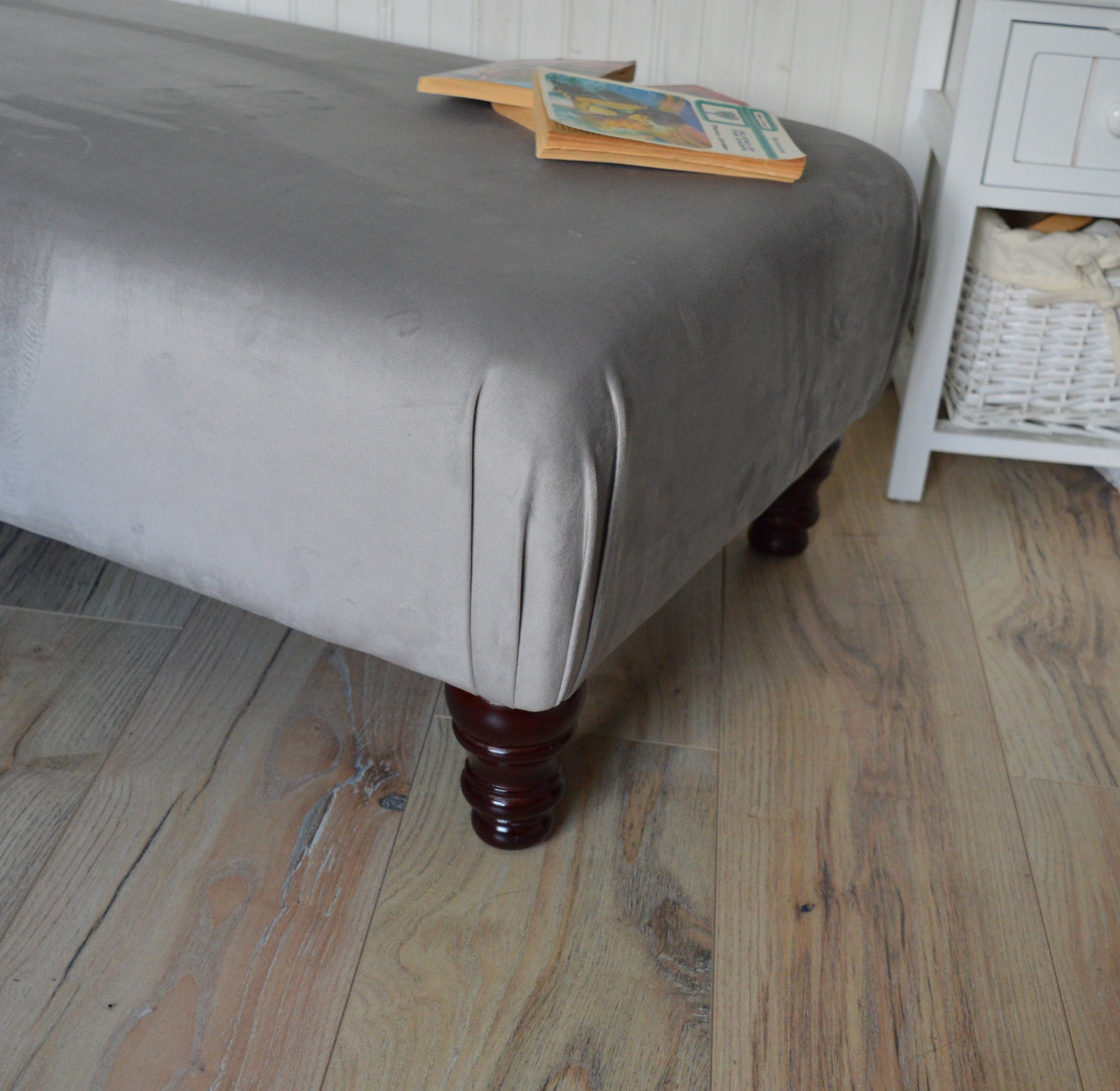 A Flat Top Footstool In Luxury Silver Velvet Fabric With Turned Mahogany Wood Legs