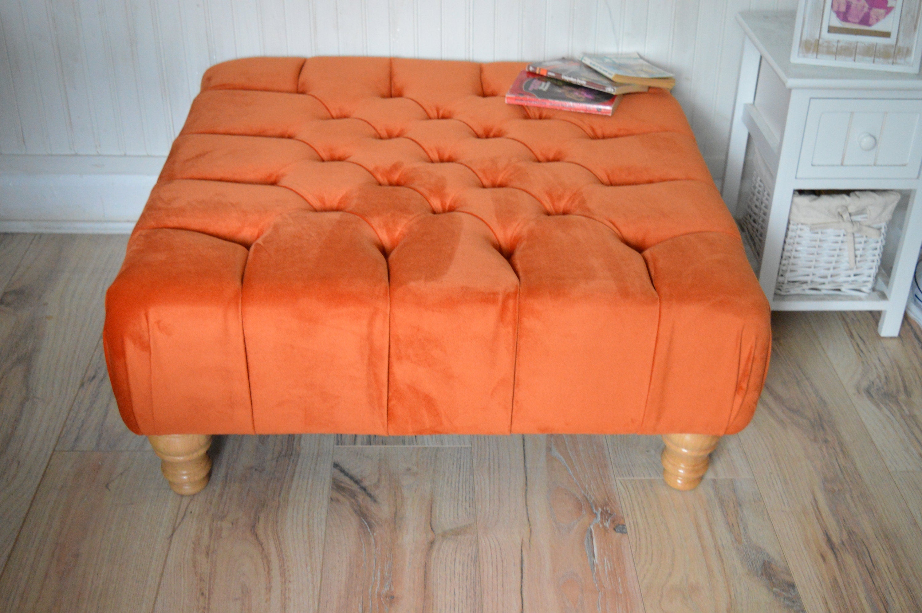 Square Chesterfield Deep Buttoned Footstool in Plush Orange Velvet With Natural Turned Hard Wood Legs