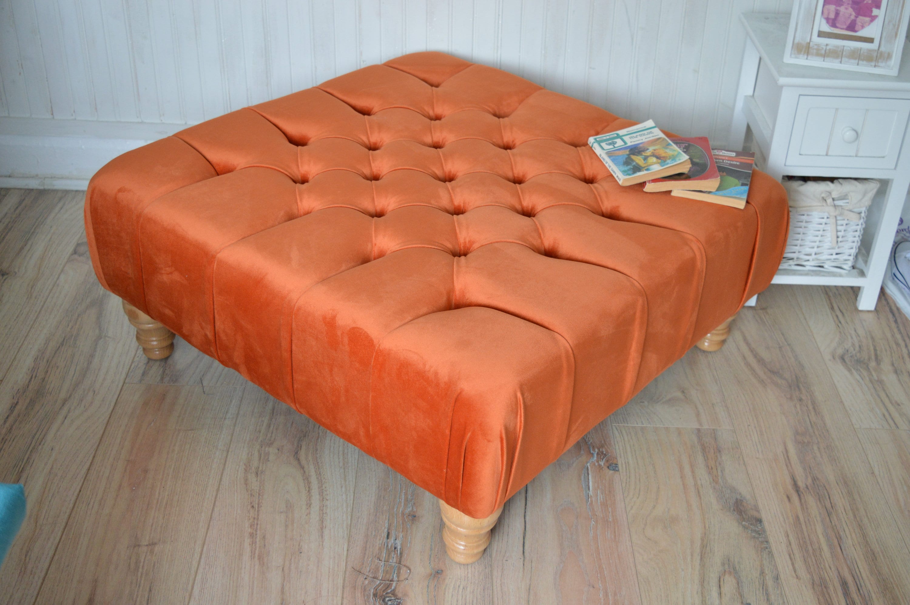 Square Chesterfield Deep Buttoned Footstool in Plush Orange Velvet With Natural Turned Hard Wood Legs