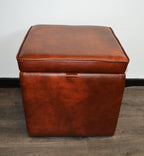 A Stylish  Cube Design footstool With Storage Ottoman footrest upholstered in a Premium Chestnut Faux Leather