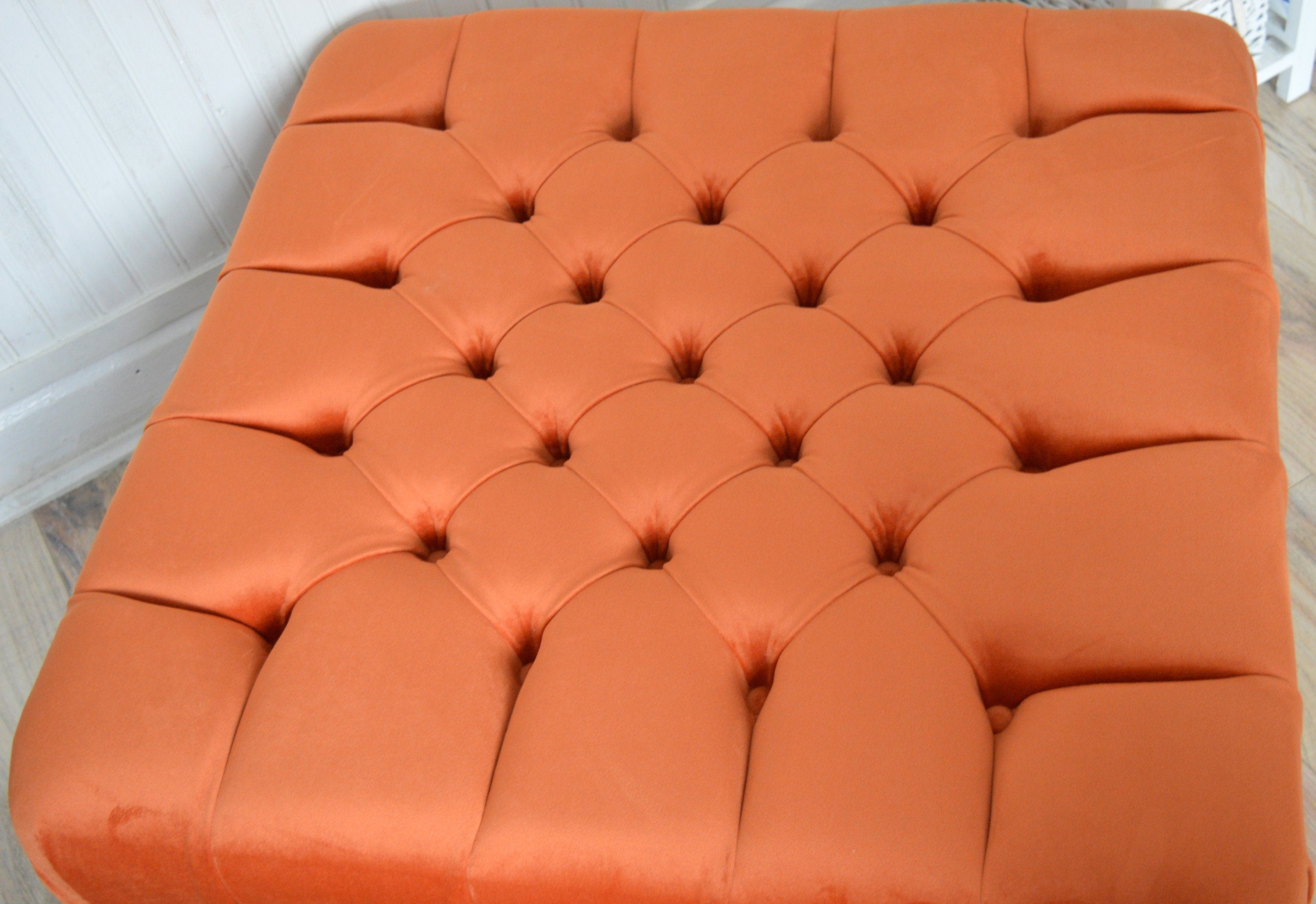 Square Chesterfield Deep Buttoned Footstool in Plush Orange Velvet With Natural Turned Hard Wood Legs