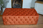 Chesterfield Style Deep Buttoned All Over Extra Large Footstool Upholstered In a Plush Burnt Orange Velvet