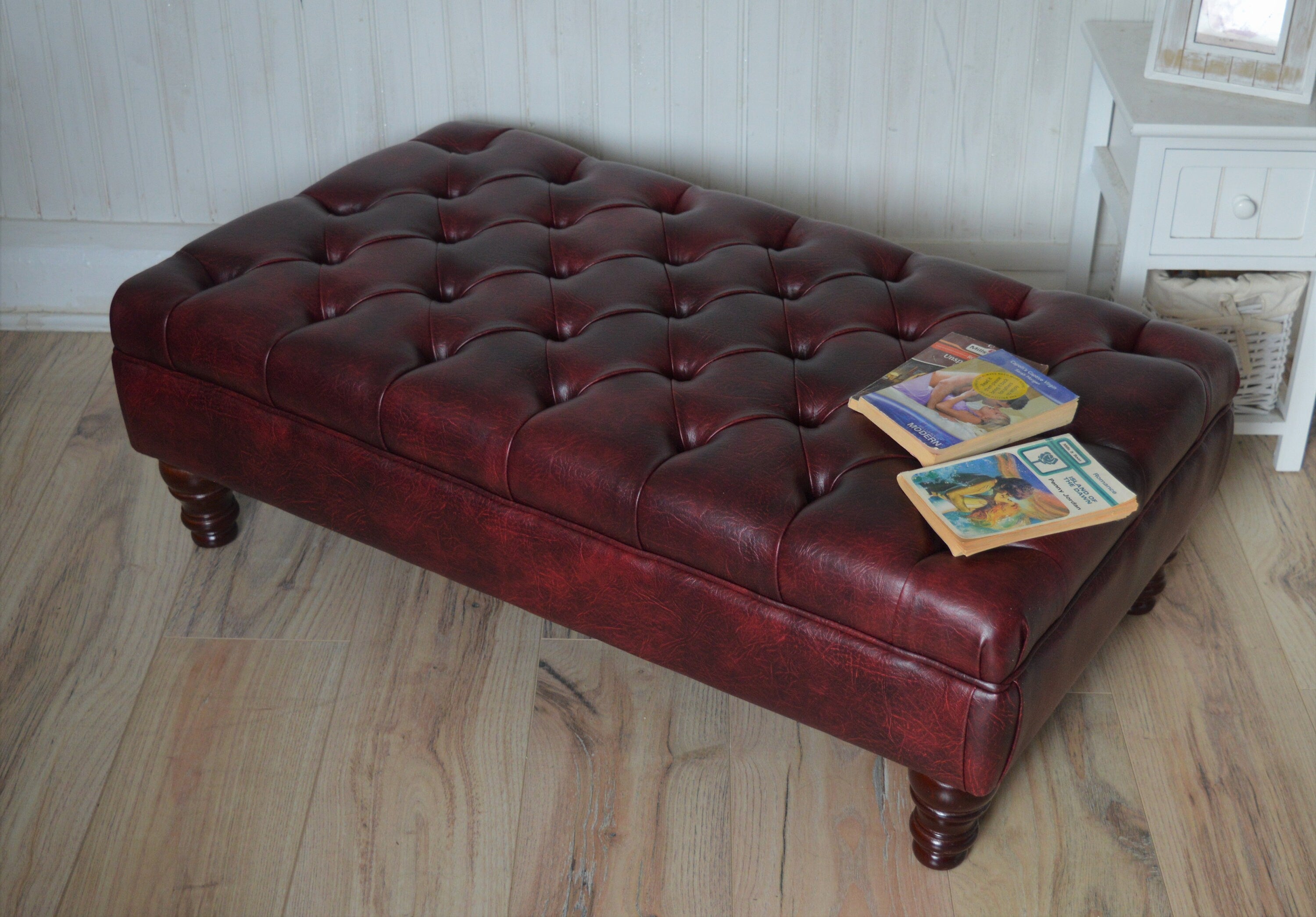 Chesterfield Style Deep Buttoned Footstool in Premium Wine Faux Leather With Turned Mahogany Hardwood Legs