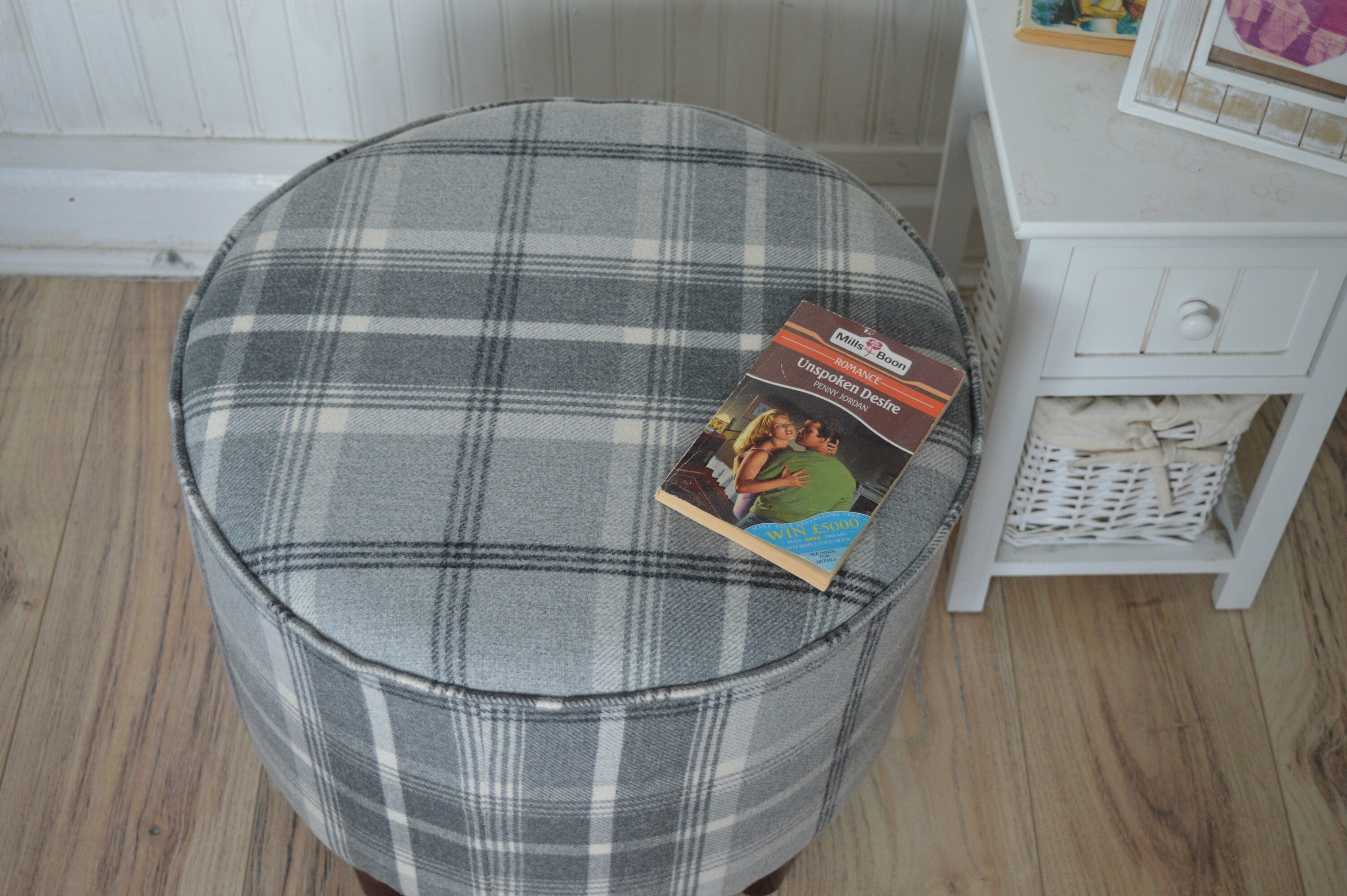 Circular round footstool upholstered in Balmoral Dove Grey Wool Effect Check Tartan Fabric With Turned Mahogany Hardwood  Legs