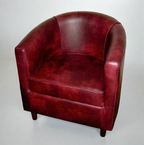 Tub Chair Upholstered In A Wine Faux Leather With Mahogany Wood Legs