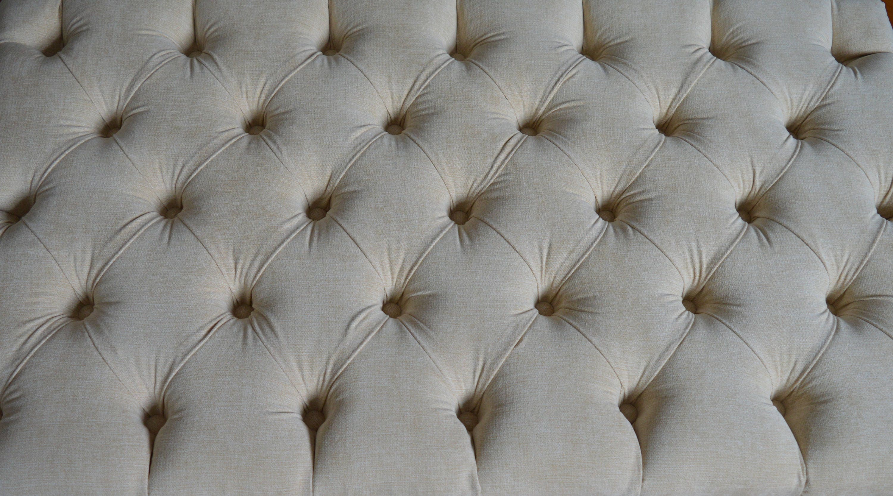 Chesterfield Deep Buttoned Footstool in Casino  Beige Fabric With Turned Mahogany Wood Legs