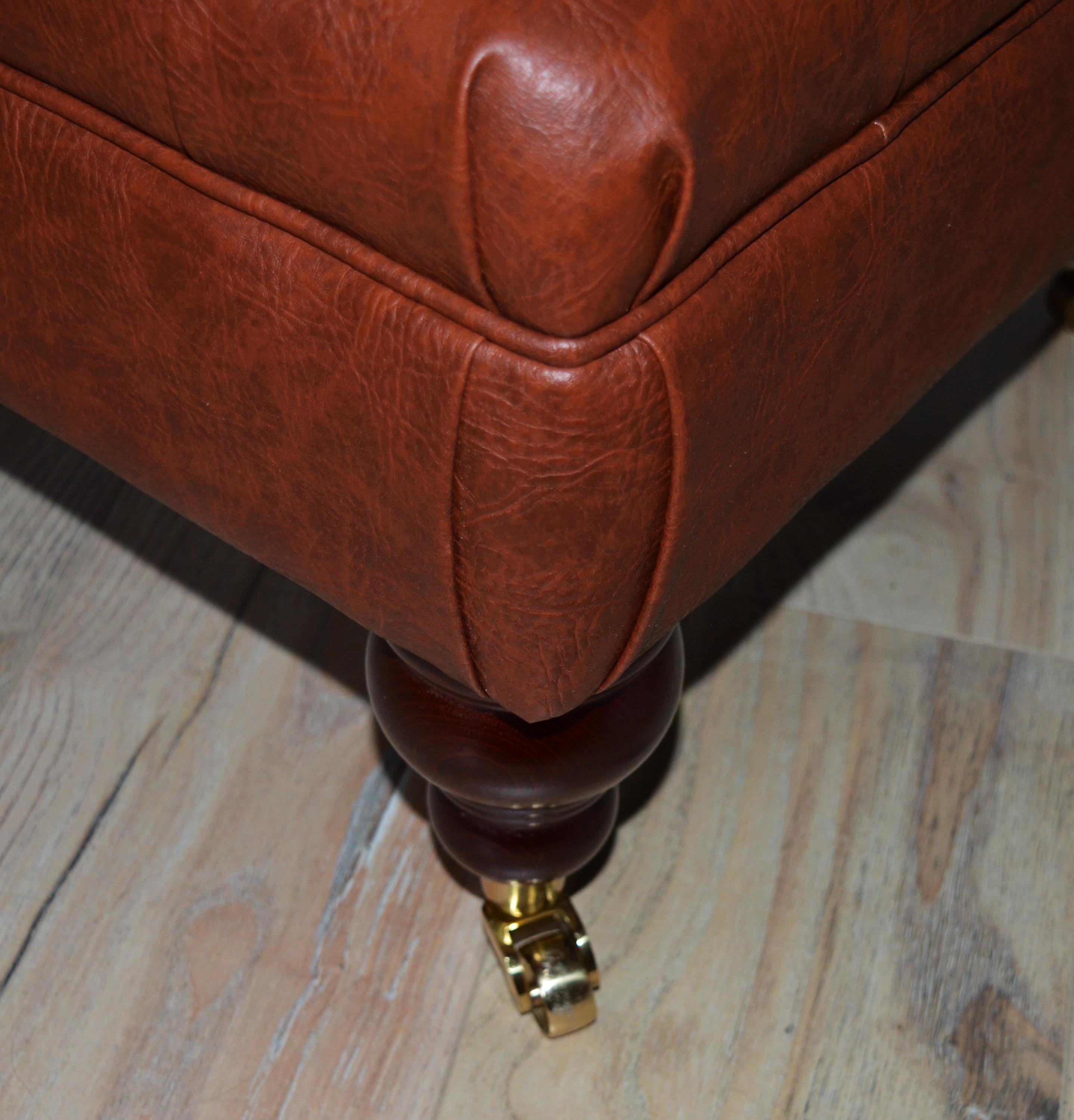 Chesterfield Design Footstool in Chestnut Brown Faux Leather With Brass Castor Turned Hardwood Legs