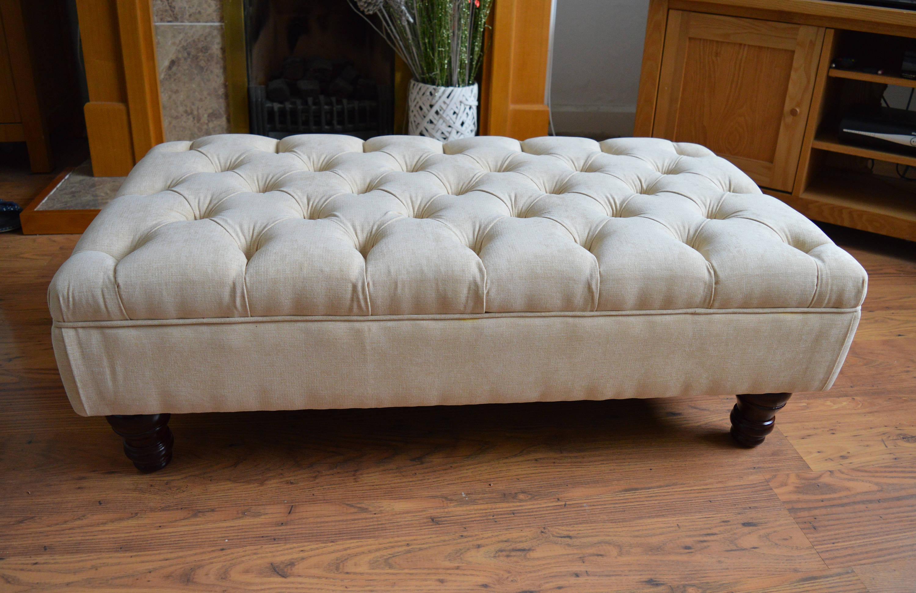 Chesterfield Deep Buttoned Footstool in Casino  Beige Fabric With Turned Mahogany Wood Legs
