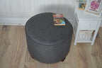 Circular round footstool upholstered in Warwick Rouen Charcoal Fabric With Turned Mahogany Hardwood  Legs