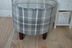 Circular round footstool upholstered in Balmoral Dove Grey Wool Effect Check Tartan Fabric With Turned Mahogany Hardwood  Legs