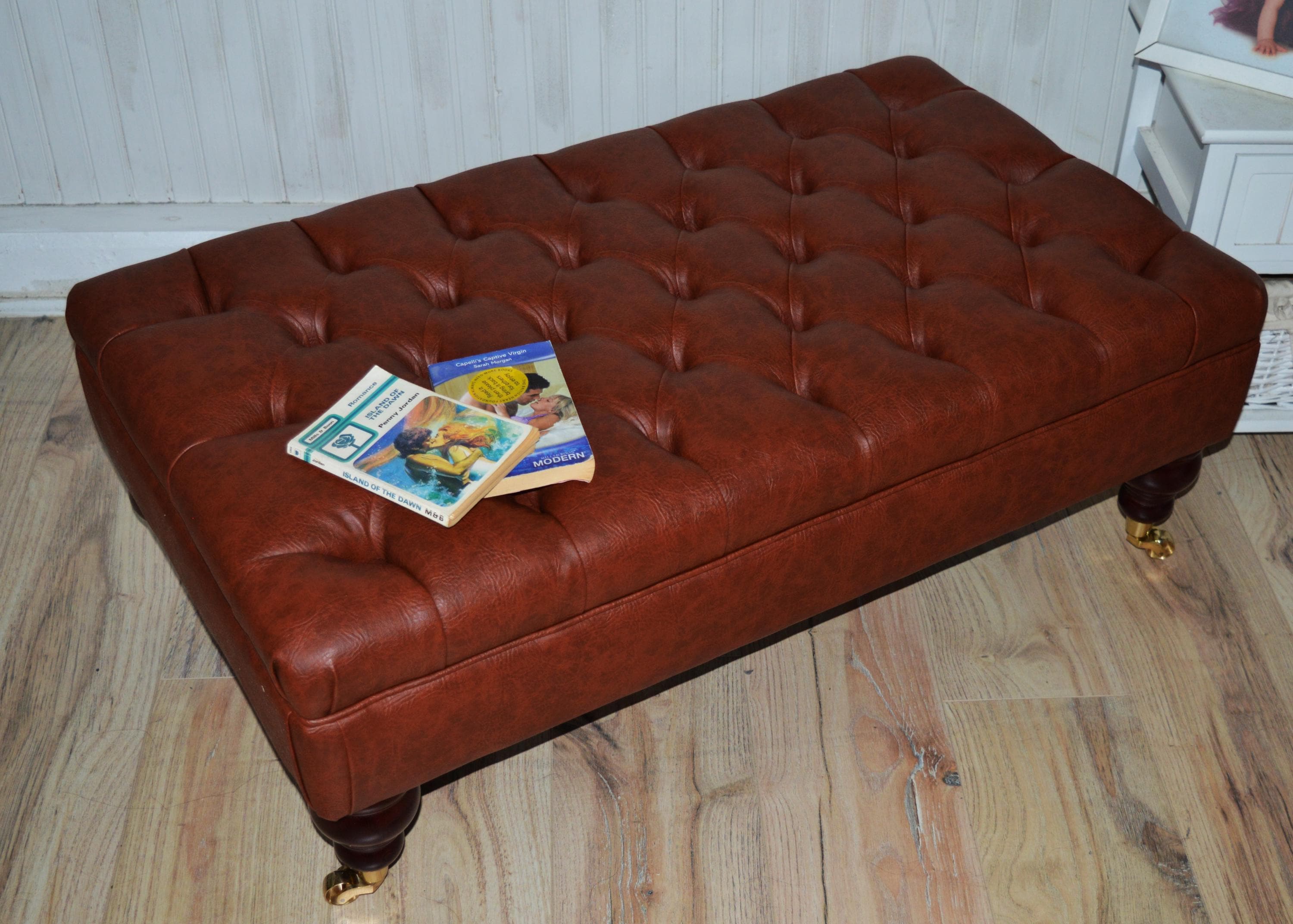 Chesterfield Design Footstool in Chestnut Brown Faux Leather With Brass Castor Turned Hardwood Legs