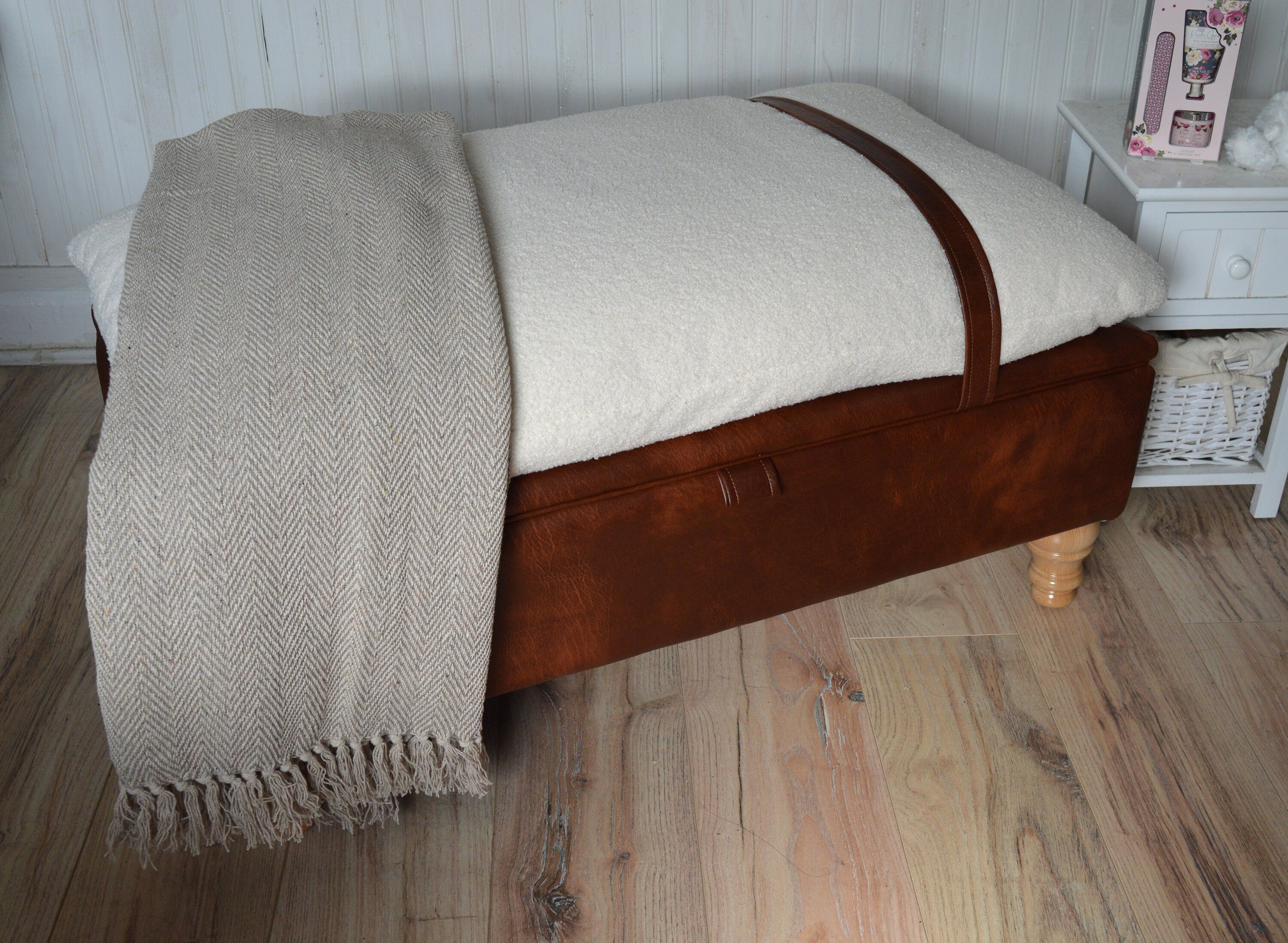 Mayfair Ottoman Footstool With Storage in Ivory Boucle Fabric With A Chestnut Faux Leather Base And Oak Turned Hardwood Legs