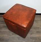 A Stylish  Cube Design footstool With Storage Ottoman footrest upholstered in a Premium Chestnut Faux Leather