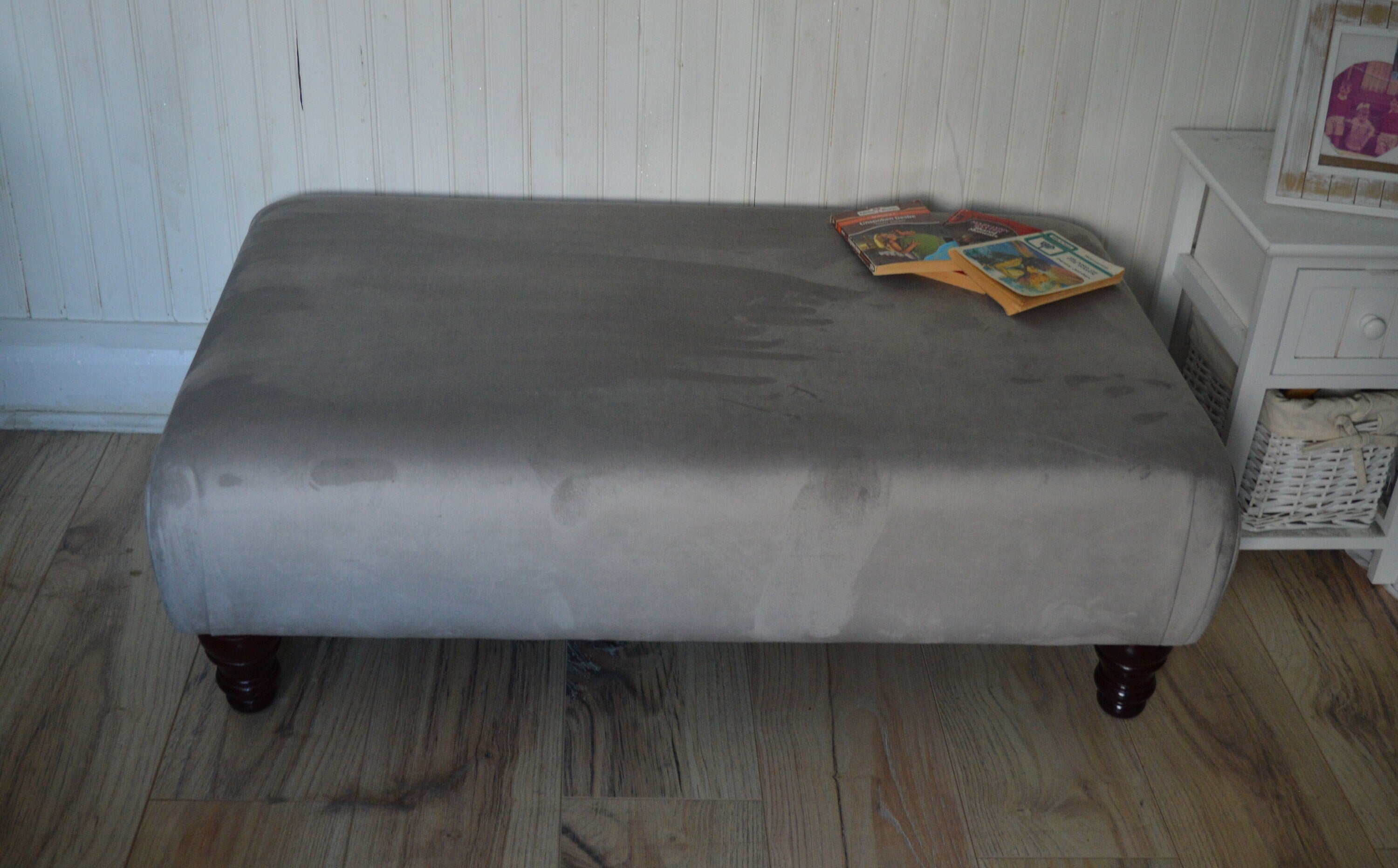 A Flat Top Footstool In Luxury Silver Velvet Fabric With Turned Mahogany Wood Legs