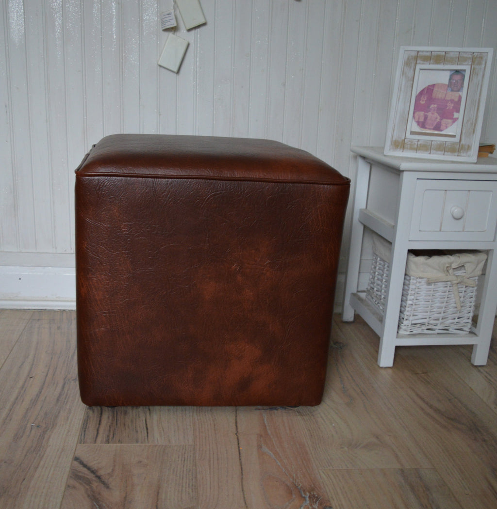 A Stylish  Cube Design footstool footrest upholstered in a Premium Chestnut Faux Leather