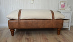 Mayfair Footstool  in Ivory Boucle Fabric And Premium Tan Faux Leather With Dark Oak Legs.
