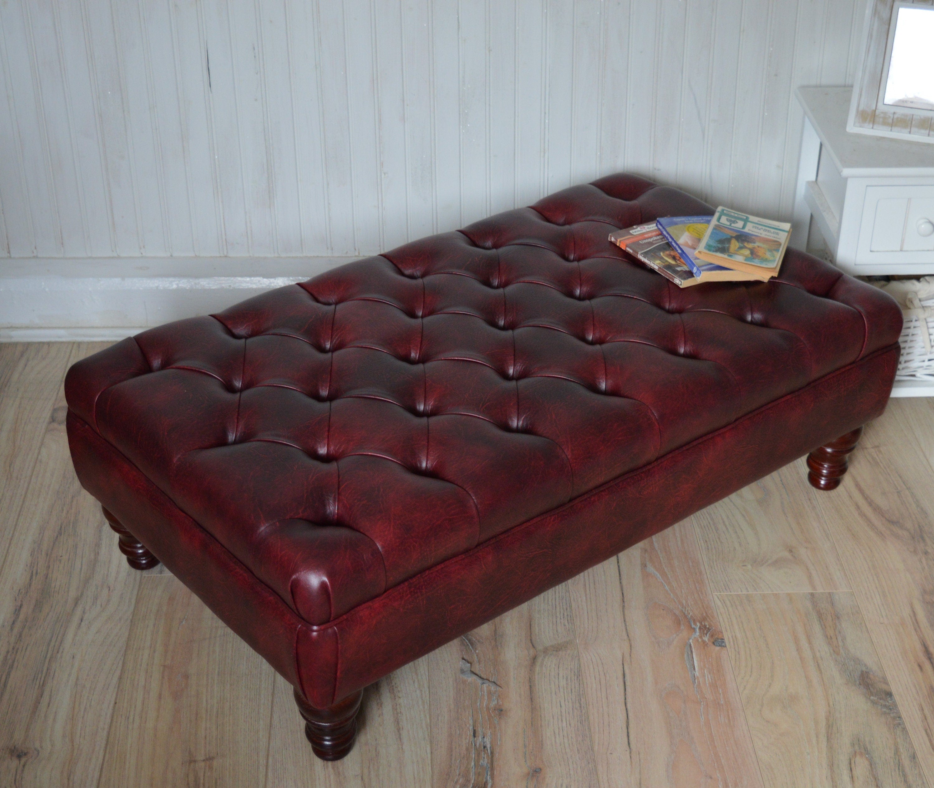 Chesterfield Style Deep Buttoned Footstool in Premium Wine Faux Leather With Turned Mahogany Hardwood Legs