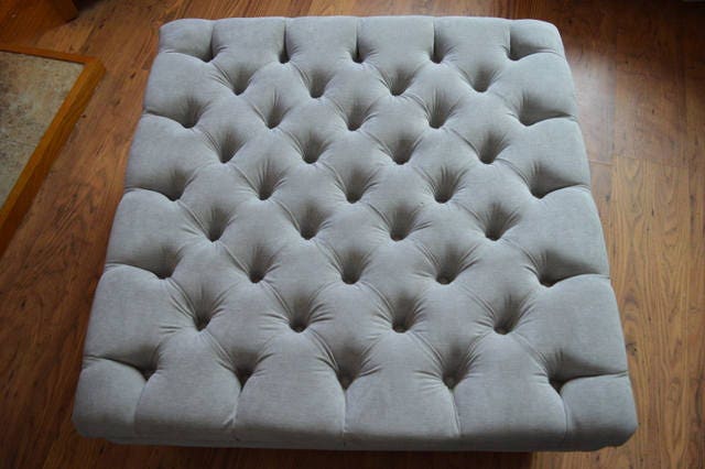 Square  Style Deep Buttoned Footstool in Casino Crush Silver Fabric With Turned Hard Wood Legs