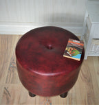 Circular round footstool upholstered in a premium wine faux leather with 4 cylinder Hard Wood Legs