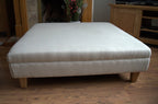 Extra Large Flat Top Footstool in 100% Danila White Sand  linen With Oak Legs Size is 100CM X 100CM