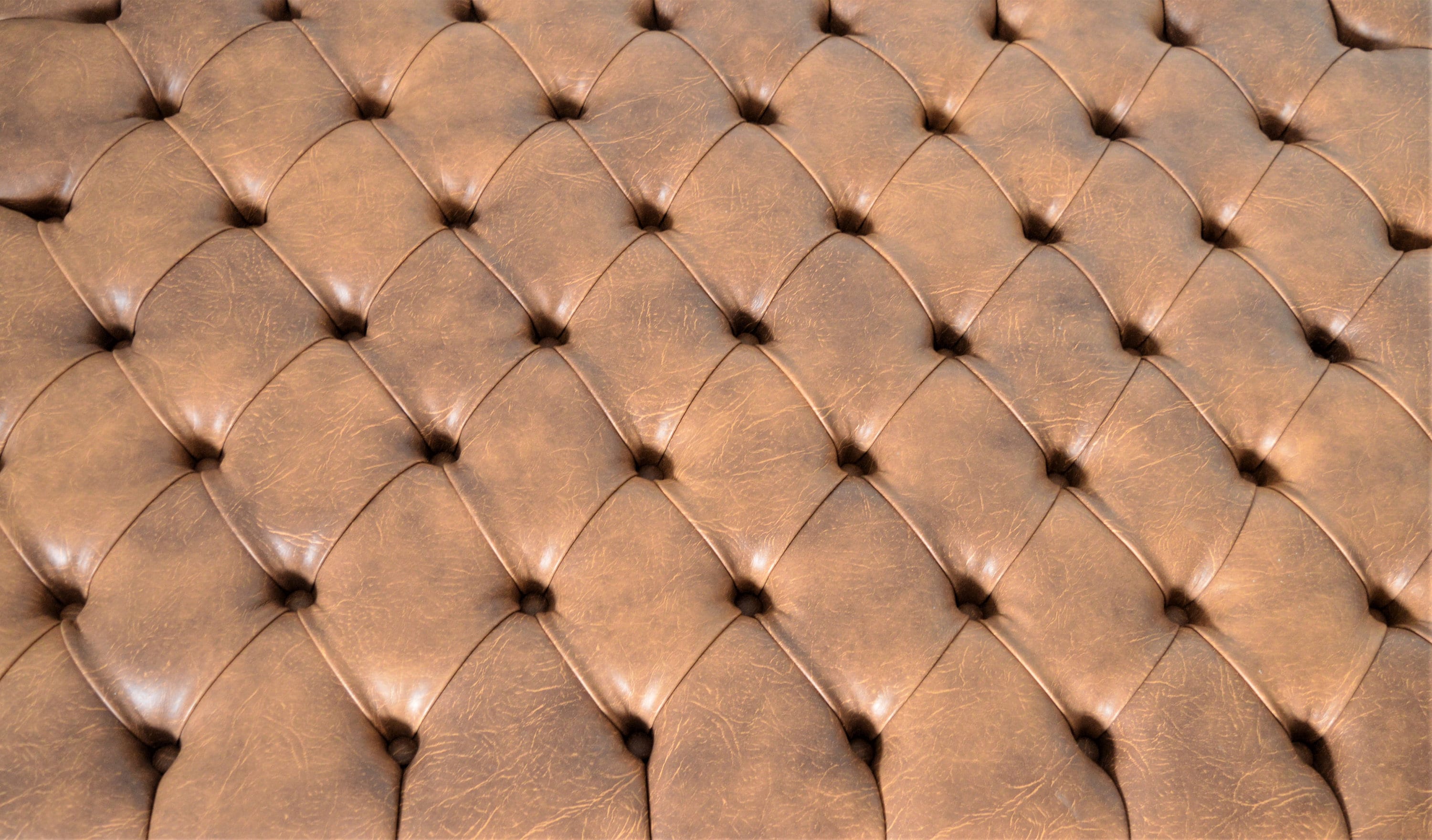 Chesterfield Extra Large Deep Buttoned Footstool in Premium Tan Faux Leather With Mahogany Turned Hardwood Legs