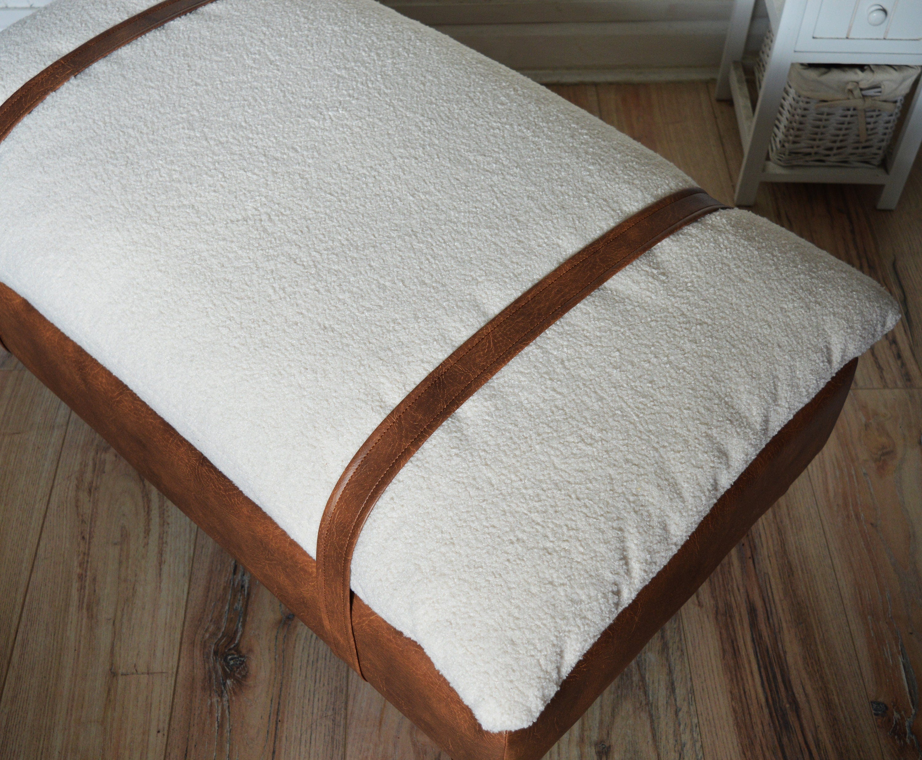 Mayfair Footstool  in Ivory Boucle Fabric And Premium Tan Faux Leather With Dark Oak Legs.
